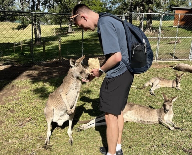 Simon feeding a kangaroo