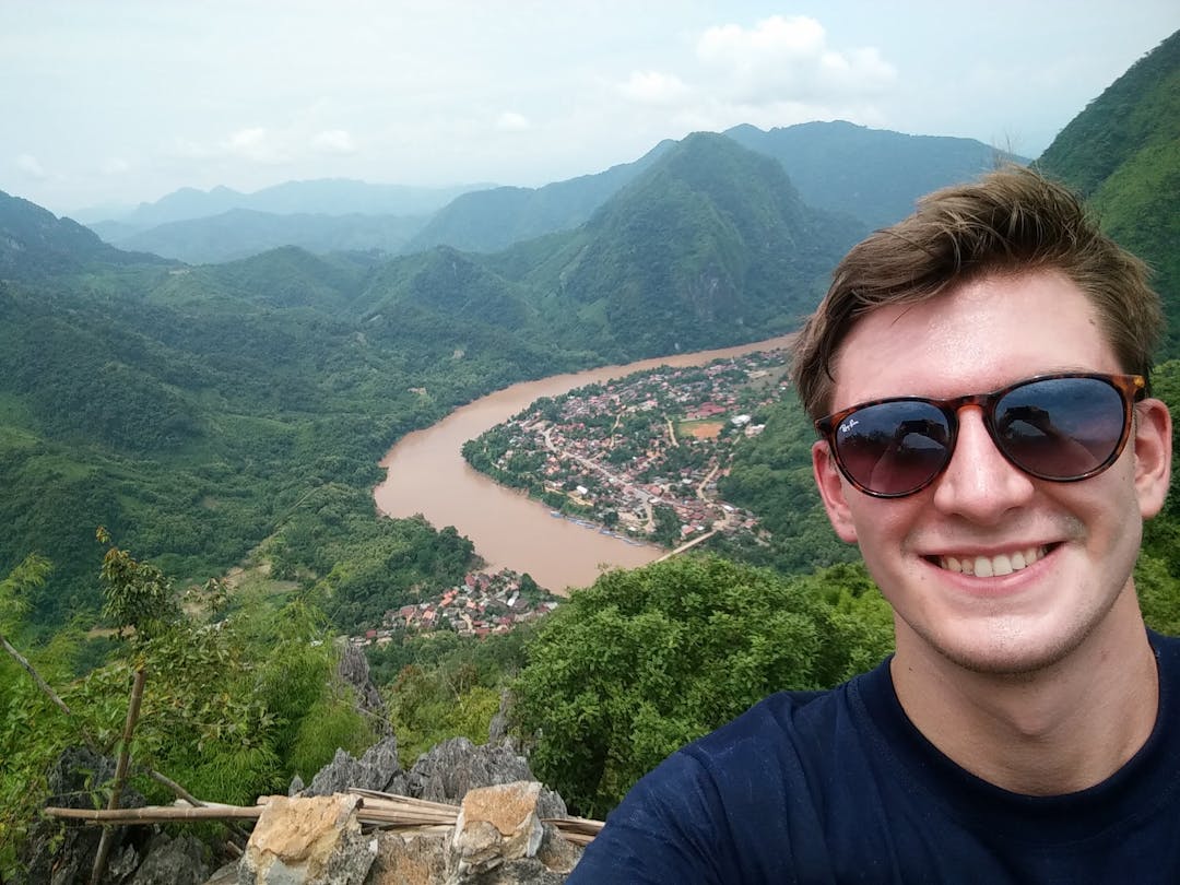 A younger, fresh-faced Simon on his first solo trip in 2016 (Muang Ngoy, Laos)