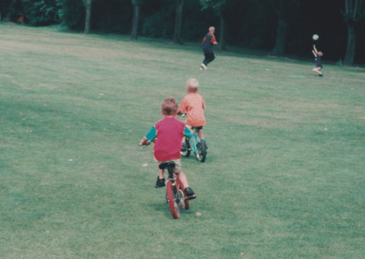 Two boys riding bikes